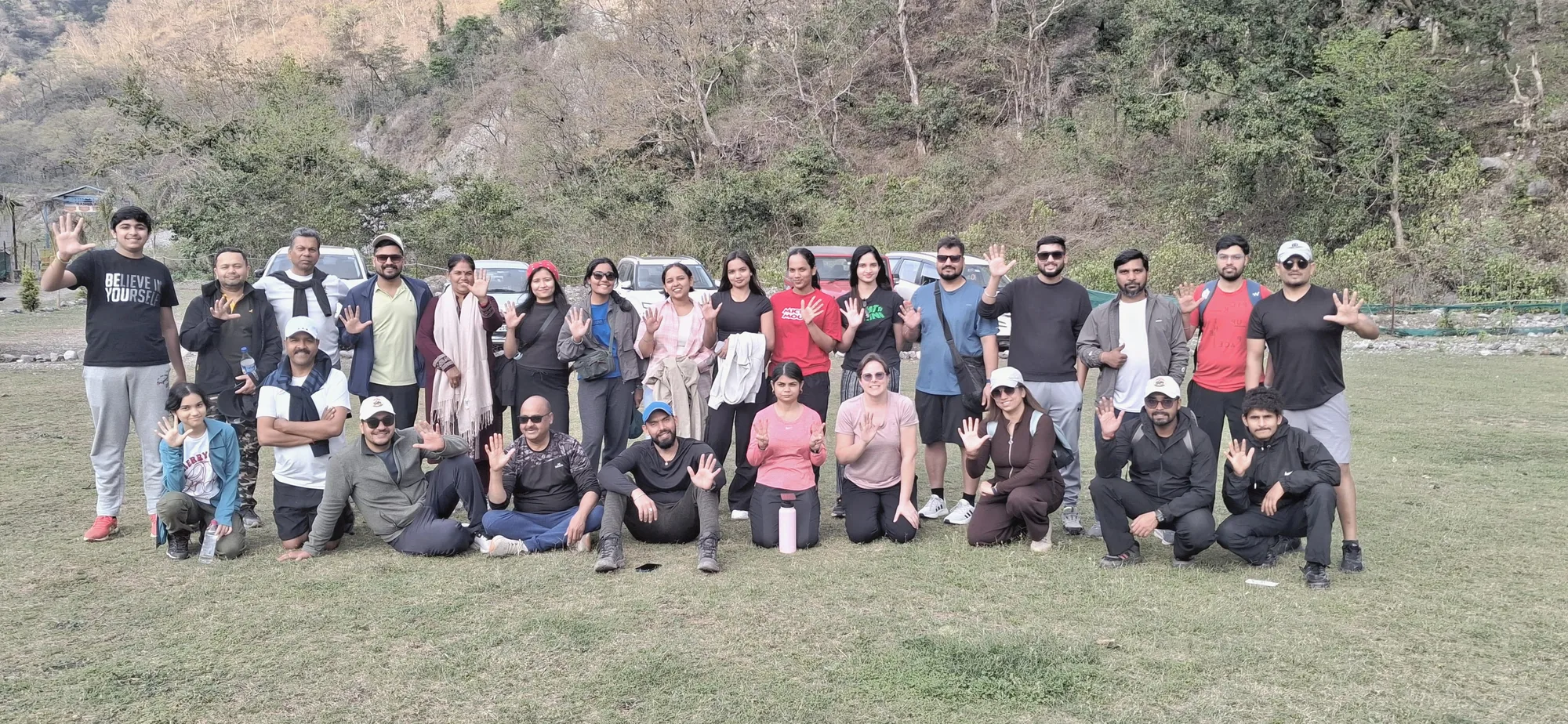 Adventurers conquering thrilling rapids during a 24 km river rafting expedition in Rishikesh.